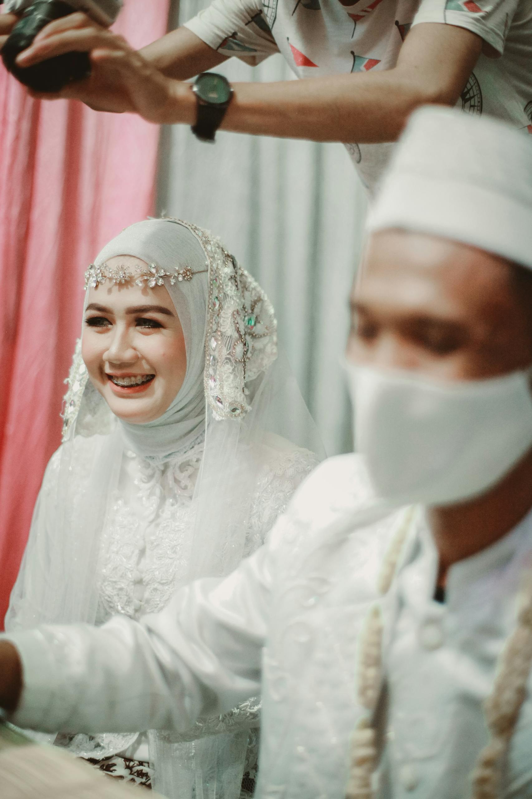 Woman in White Hijab and White Wedding Dress